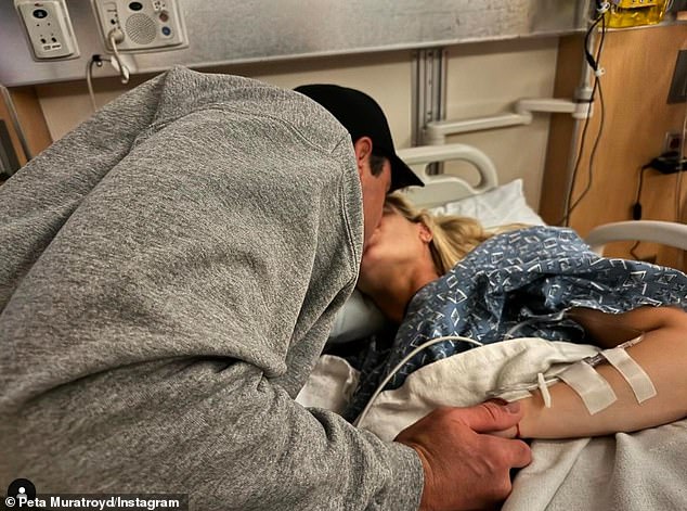 The couple shared a snap of Peta in labor just hours before the birth