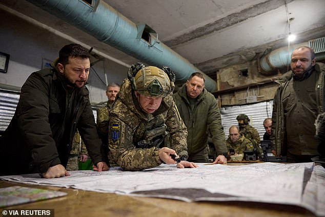 Ukrainian President Volodymyr Zelenskyy and Defense Minister Rustem Umerov listen to Ground Forces Commander Colonel General Oleksandr Syrskyi during their visit to a Ukrainian military position in the city of Kupiansk