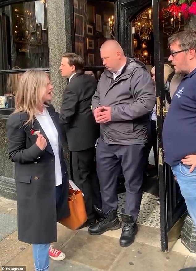 The woman points to the Palestinian flag on her jacket and gets into an argument with the employee