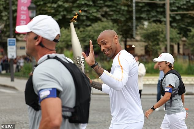 Henry, pictured waving to fans, will coach the French team in the men's football tournament