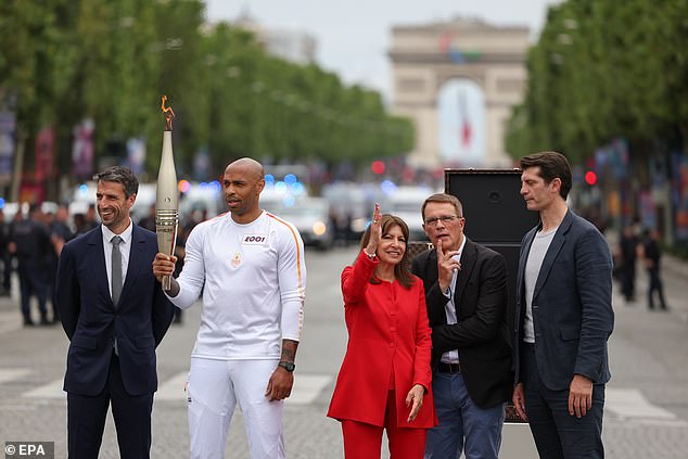 Former striker Henry stood shoulder to shoulder with the president of the Paris 2024 organising committee, Tony Estanguet (left) and the mayor of Paris, Anne Hidalgo (centre).