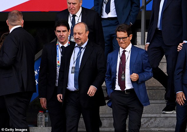 Former England manager Fabio Capello is in attendance at the match and was seen walking down a flight of stairs with former Liverpool manager Rafael Benitez.