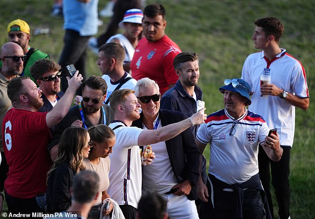 Martin and Roman had to take pictures with some English supporters