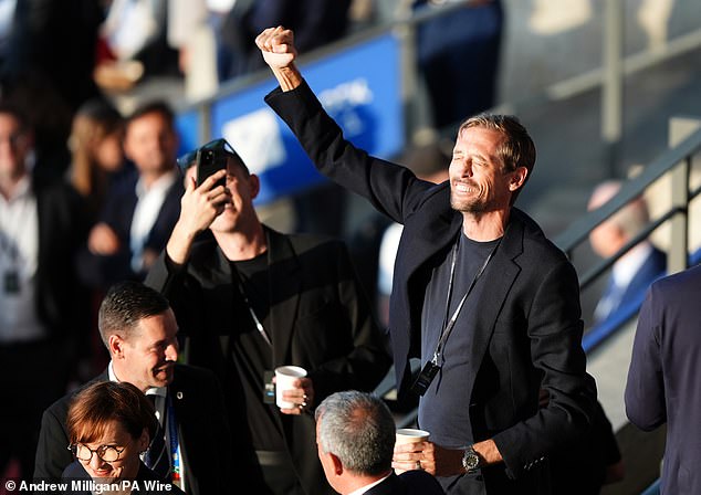 Peter couldn't wipe the smile off his face as he cheered on the boys and sang along with the crowd