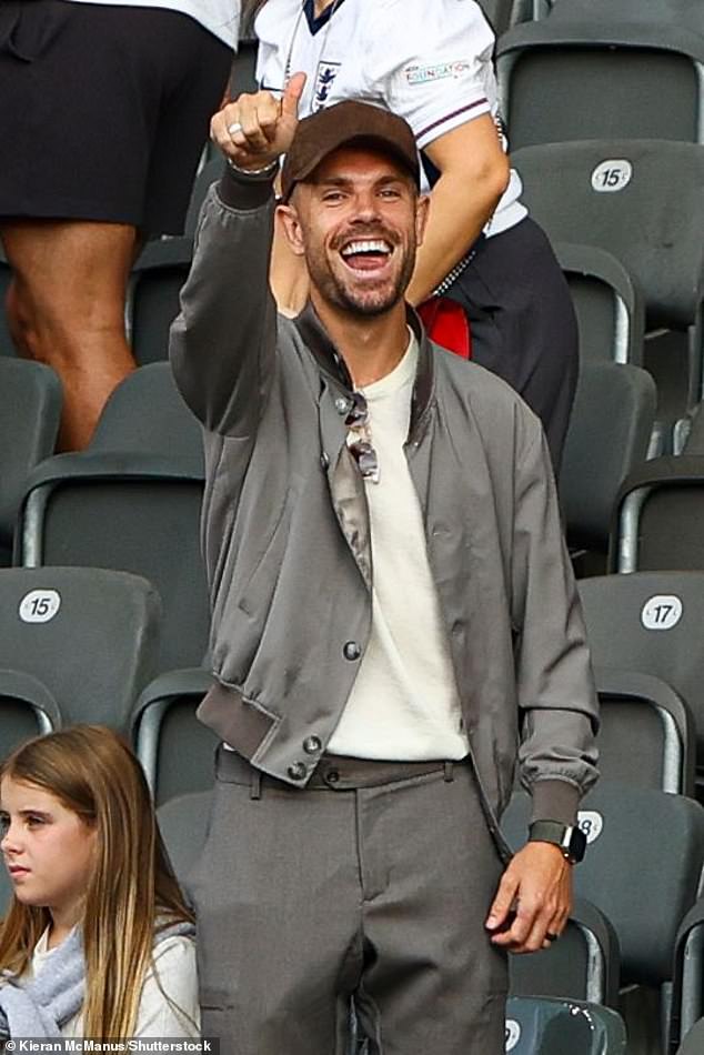 English footballer Jordan Henderson gave a thumbs up as he watched from the stands