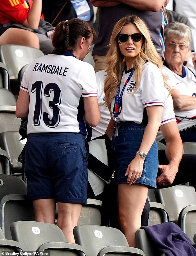 Georgina Irwin (right), wife of England goalkeeper Aaron Ramsdale, arrives in the stands in Berlin