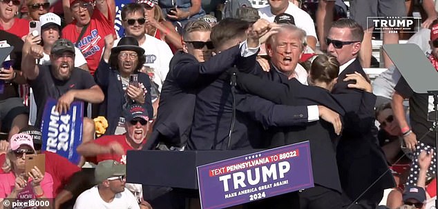 Immediately after the shots were fired, former President Trump was pushed to the ground behind reinforced barriers by US Secret Service agents