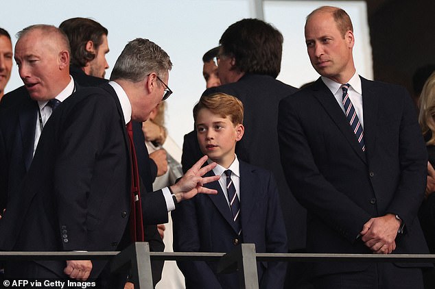 Prime Minister Keir Starmer is seen speaking to Prince William and Prince George during the opening minutes of the match