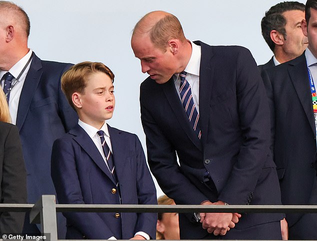 Pictured: Prince William and Prince George stand nervously in the VIP box during the opening moments