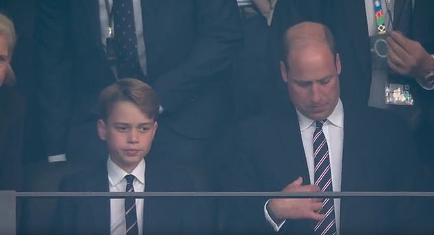 Just before the national anthem began playing, the royal father and son were also seen in the stands - with Prince George straightening his tie, moments before William did the same