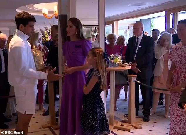 A star-struck Charlotte looked slightly shy as she stood next to Kate and smiled at Alcaraz during their conversation, while her aunt Pippa stood behind the pair and grinned at the interaction