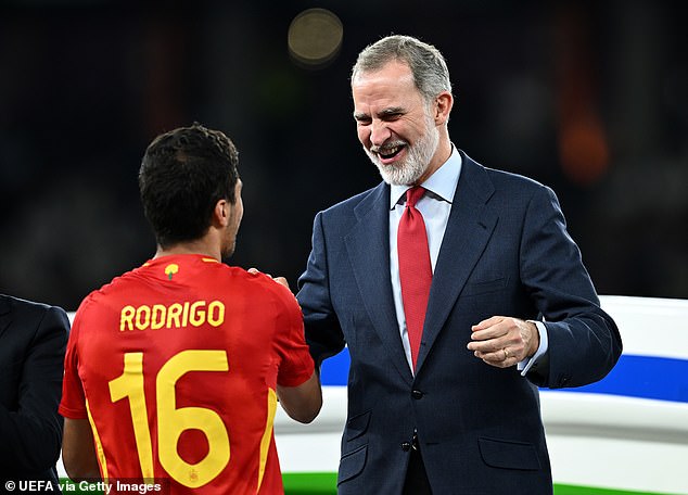 The beaming king shook hands with all the national team players as they received their medals