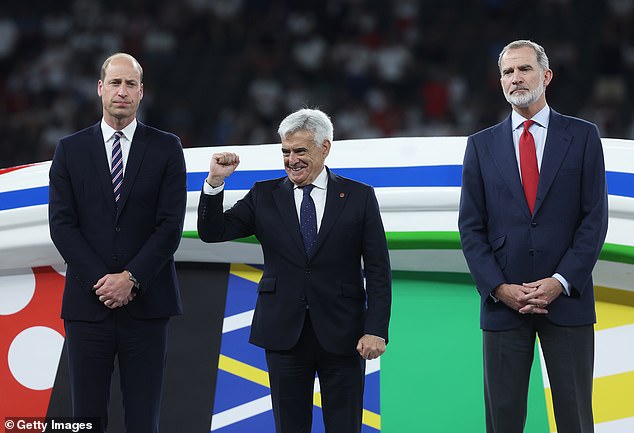 Prince William and King Felipe are on the pitch to greet the players after the intense match