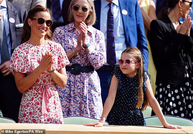 Pippa looked effortlessly elegant in a fitted red floral midi dress with pleated layers