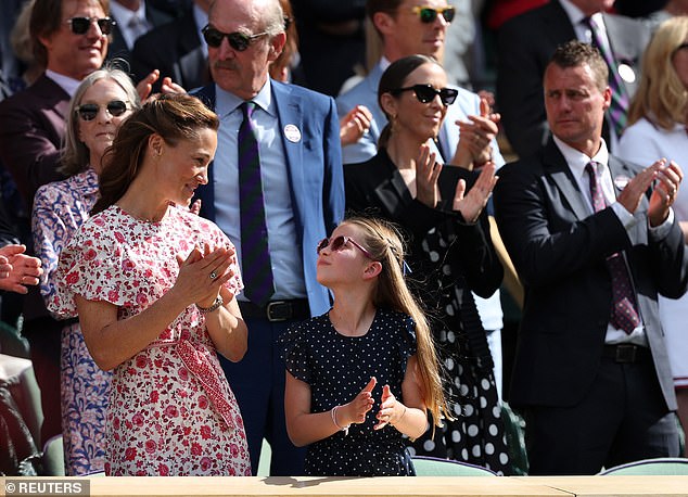 Princess Charlotte complimented her aunt Pippa in a navy and white polka dot dress by Guess with pleated sleeves