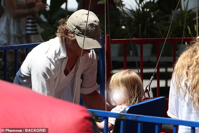 Jeremy donned a khaki cap over his curls and occasionally wore sunglasses to combat the glare of the Southern California sun.