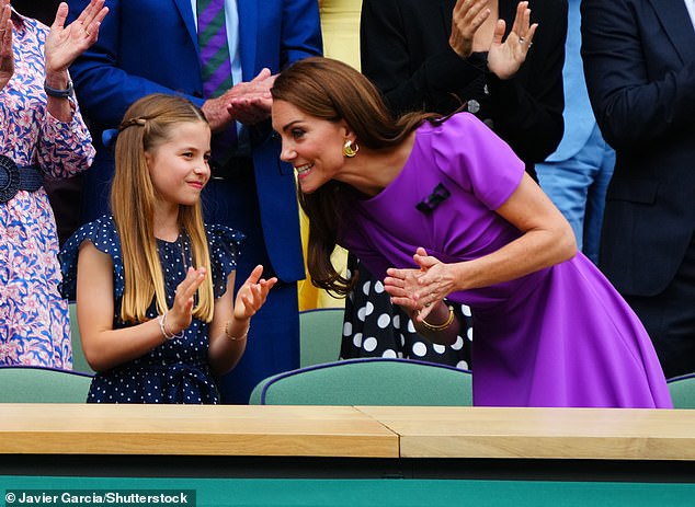 Charlotte and Kate smile as they watch the action on Centre Court from the Royal Box