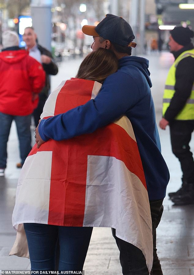 The English supporters had to console each other when they realised that there would be no trophy to take home again