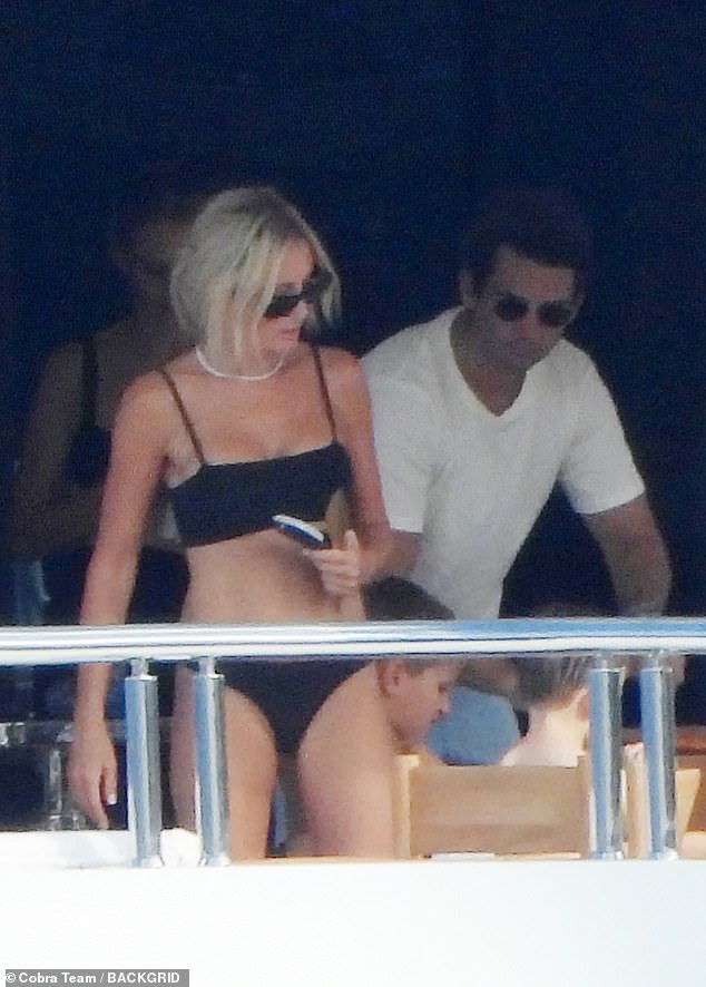 Roxy showed off her toned body and tanned skin in a stylish black bikini as she enjoyed the summer weather