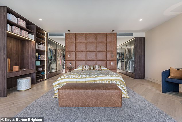 Other features include a walk-in wine cellar large enough to hold 800 bottles, a swimming pool, an adjoining spa and landscaped gardens. Pictured: One of the six bedrooms