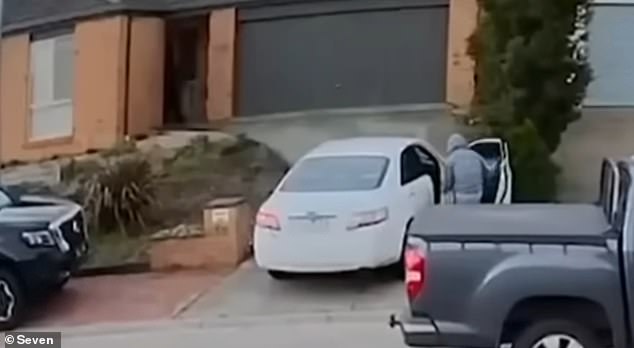 The 17-year-old boy, who was seen wearing a gray hoodie (pictured), got into the car while the delivery driver was dropping off some food at a house, before the man noticed the alleged thief