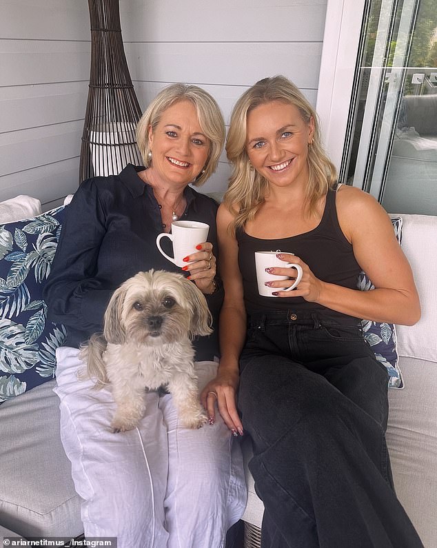 Ariarne (pictured with her mother Robyn) has always been a water rat since her difficult arrival into the world