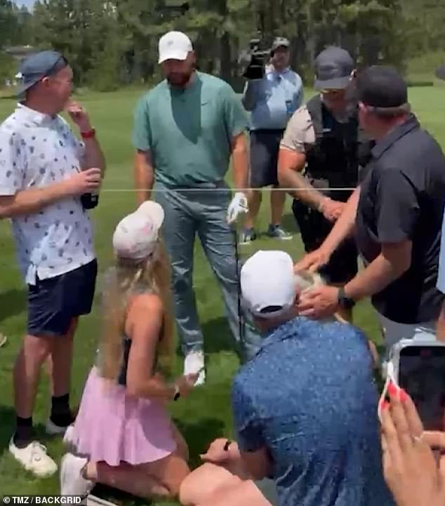 The fan was left bloodied after Kelce's golf ball hit her in the back of the head