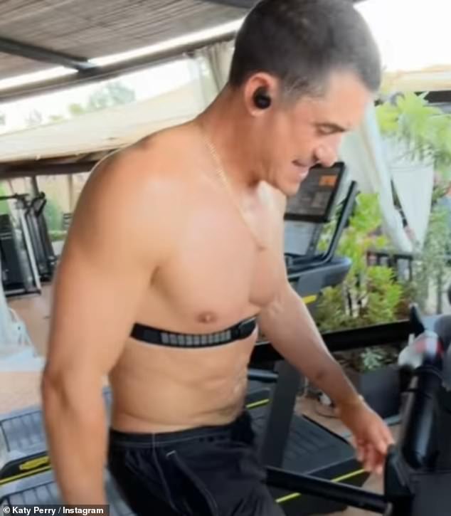 Bloom looks toned and slim as he works out with his fiancée in her latest Instagram post