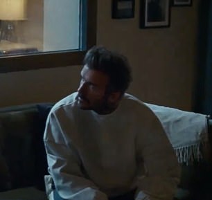 David Beckham looked out a rainy window in the ad