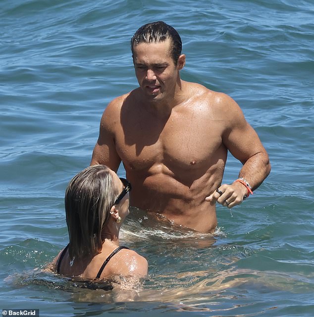 Spencer, 35, also looked great as he accentuated his toned figure in a pair of paisley-print swim trunks