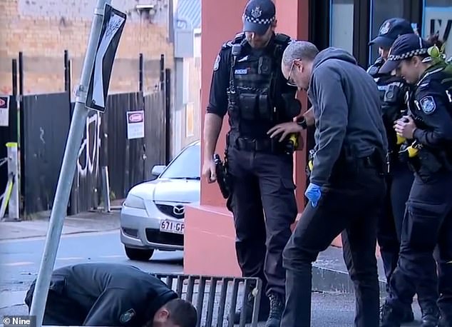 Forensic officers were seen collecting samples outside the Child Exploitation Centre on Alfred Street