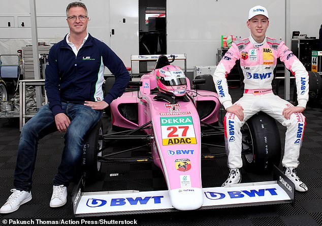 Ralf Schumacher is pictured with his son David Schumacher as he presents his FIA Formula 4 racing car in 2018