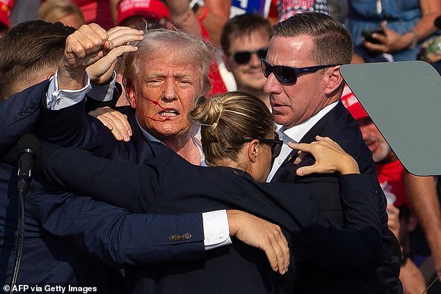 Donald Trump's ear was hit by one of Crooks' bullets during his rally in Butler, Pennsylvania. Secret Service units helped him off the stage as the former president raised his fist in the air and shouted 