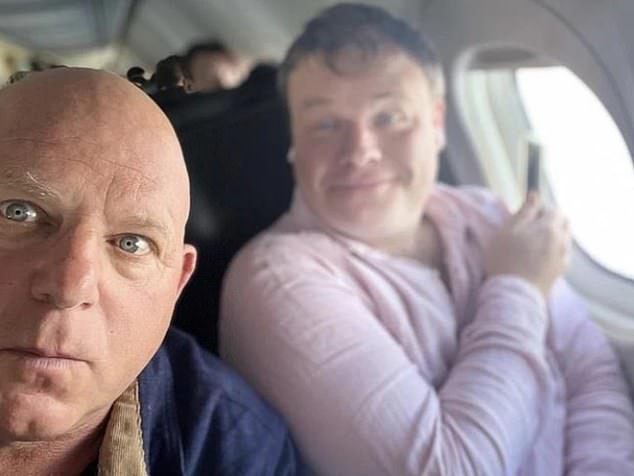 Mark Llewellyn is pictured on the left, with Taylor Auerbach on the right, on a plane to see Lehrmann and entice him into an exclusive interview.