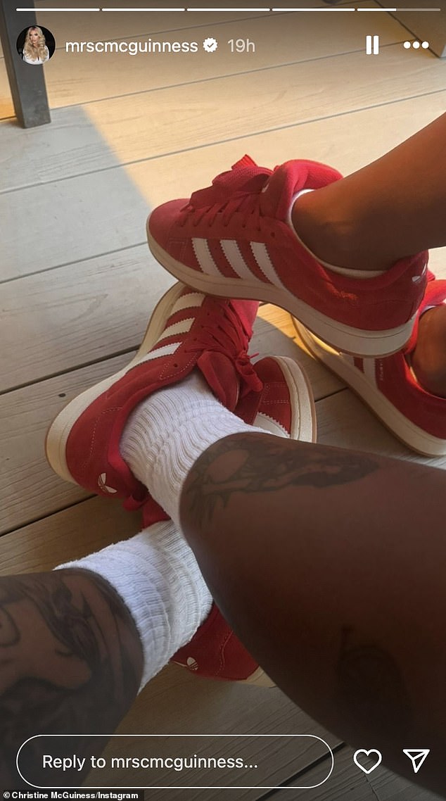 The model, 36, and her mystery partner wore matching red Adidas trainers, with only the man's tattooed leg visible