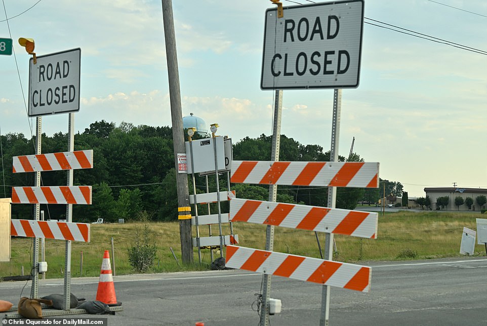 Police cars were lined up along the perimeter of the fairgrounds, while large sections of the highway were closed to through traffic as police investigated the crime scene