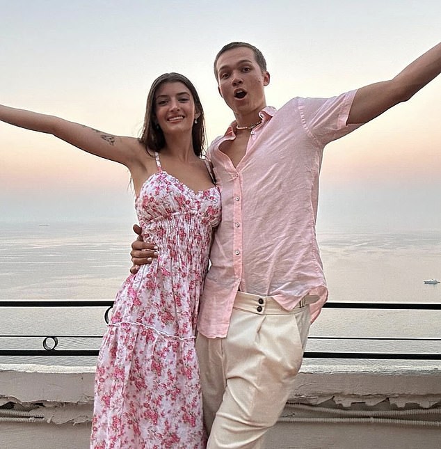 Sami shared a carousel of photos on Instagram of the couple standing at a scenic viewpoint with the Aegean Sea behind them