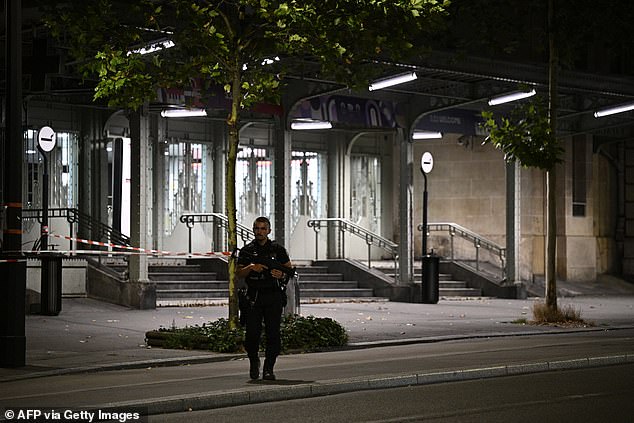 A police officer stands guard outside the Gare de l'Est train station after the soldier was wounded in the shoulder by the suspect who wielded the knife, in Paris on July 15, 2024