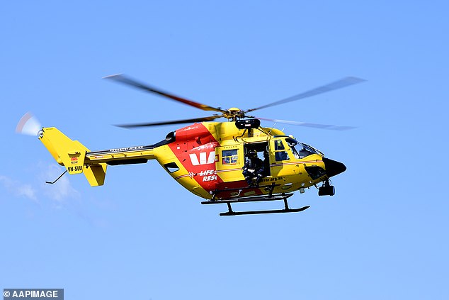 A rescue helicopter is on its way and police and the Queensland Ambulance Service were called after two swimmers failed to surface at the Millaa Millaa Falls, south of Cairns