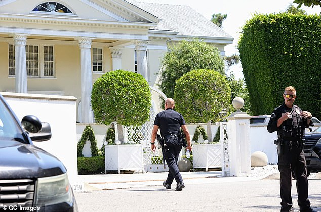 Saturday morning, authorities were seen at Simmons' home following his death