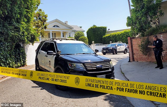 An LAFD official told ET that Simmons' body was not taken to a hospital due to his apparent natural death; police vehicles are outside Simmons' home