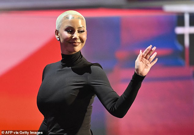 Amber Rose waves to the crowd at the Republican National Convention in Milwaukee Monday night after she endorsed former President Donald Trump's candidacy