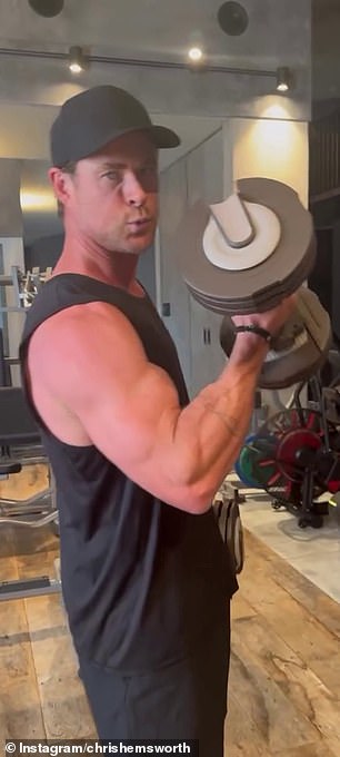 Chris effortlessly lifted a set of hand weights, taking time between reps to promote a workout program from his Centr fitness app