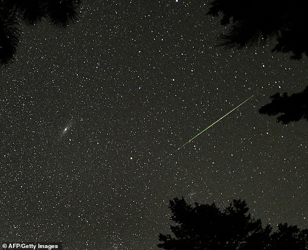 Perseid meteors travel at 133,200 miles per hour when they hit Earth's atmosphere, and most become visible to viewers when they are about 60 miles from the surface. Pictured: Perseid meteor seen over Rocky Mountain National Park in Colorado in 2018