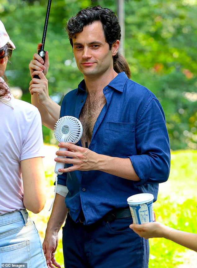 The Gossip Girl star showed off some chest hair in an open blue shirt, which he paired with blue jeans