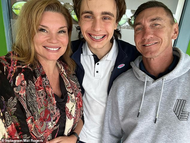 Pictured: Mat Rogers with his son Max and wife Chloe Maxwell, who also reacted angrily to the threat on social media