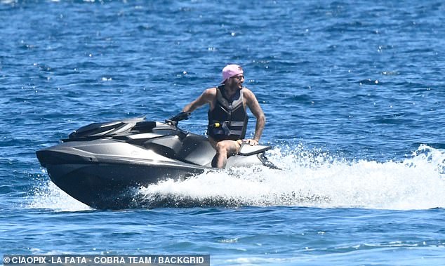 David looked in good spirits as he relaxed on his jet ski and enjoyed the sun