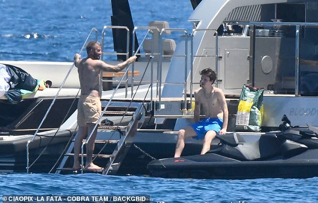 David enjoyed quality time with his youngest son as they chatted away while sunbathing