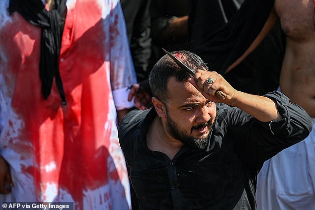 A Shiite Muslim scourges himself during a religious procession on the ninth day of the Islamic month of Muharram, today in Islamabad