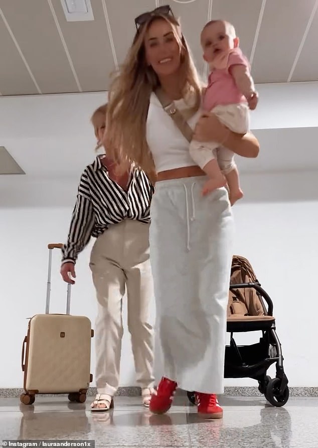 In the trending video, the trio can be seen at the airport before Laura jumps over the camera to reveal herself in a stylish pink bikini at the sun-drenched location